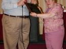 Connecticut SM Betsey Doane, K1EIC, receives a plaque in recognition of her service from New England Division Director Tom Frenaye, K1KI. [Rick Lindquist, WW1ME, photo]